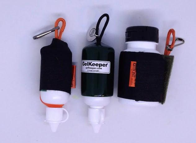 Floatant holders with black cases and orange lanyard loops, visible bottle caps and nozzles