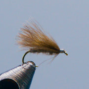 CDC caddis fly with brown feather tail and shiny dark hook