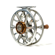 Fishing reel, silver frame with dark brown center cap and gold accents