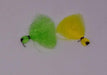 tufts of yellow and green yarn used for strike indicators when fly fishing