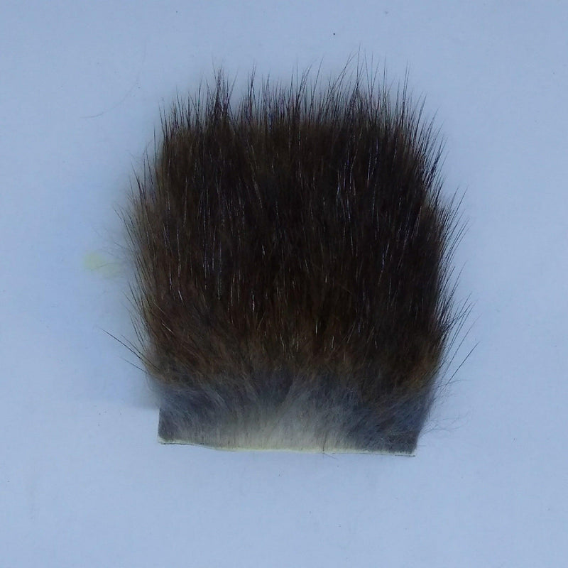 Brown muskrat fur patch with dense plush pile and straight backed edge