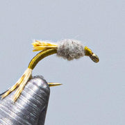 WD-50 fly fishing lure with gold thread body, gray dubbing head, and yellow tail fibers