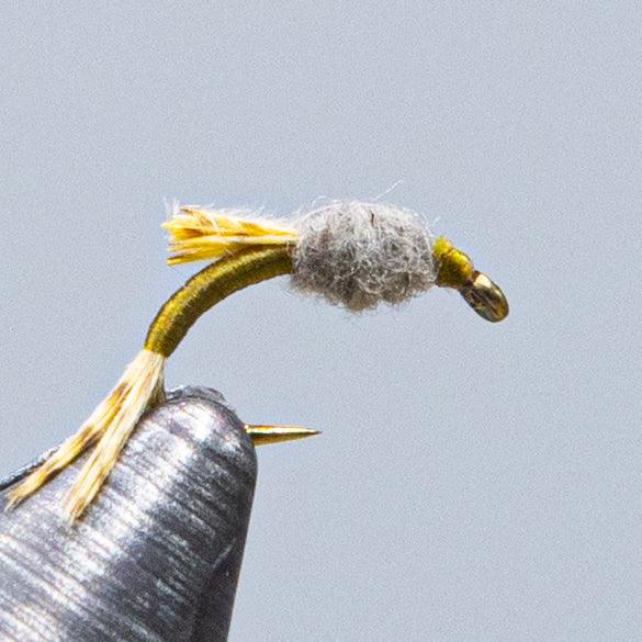 WD-50 fly fishing lure with gold thread body, gray dubbing head, and yellow tail fibers