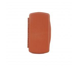 Orange molded fly box case with latch and side ridges for tackle storage