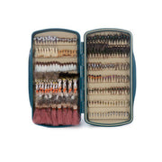 Blue tackle fly box open with multiple rows of fly lures in molded compartments