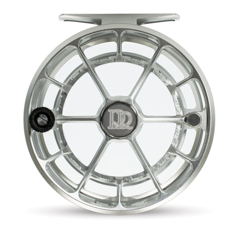 Fishing reel, matte platinum spoked spool front with central NR logo and dark knob