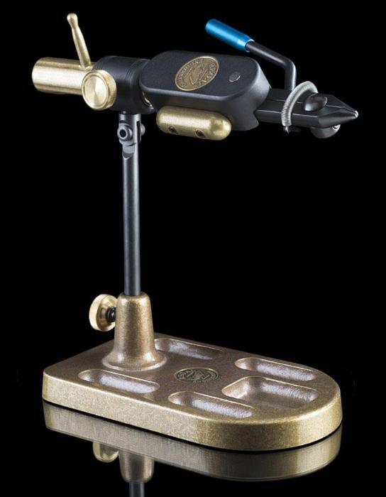 Bench-mounted metal vise with black body and gold handle, clamp jaws and pedestal base