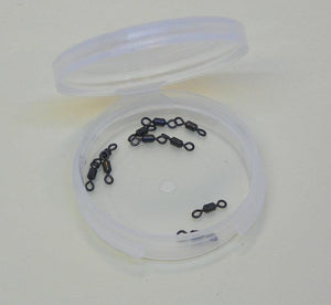 round transluscent container with 10 black nickel tippet swivels