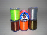 Assorted 280-denier thread spools in green, brown, orange, gray and gold