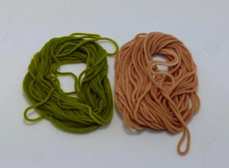 Chenille yarn balls, olive green and tan, with loose strands