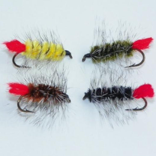 Set of four feather fishing fly lures with red tails and varied colored fuzzy bodies