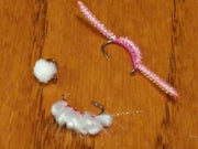 Worms and Eggs Collection two pink-and-white fishing lures with barbed hooks